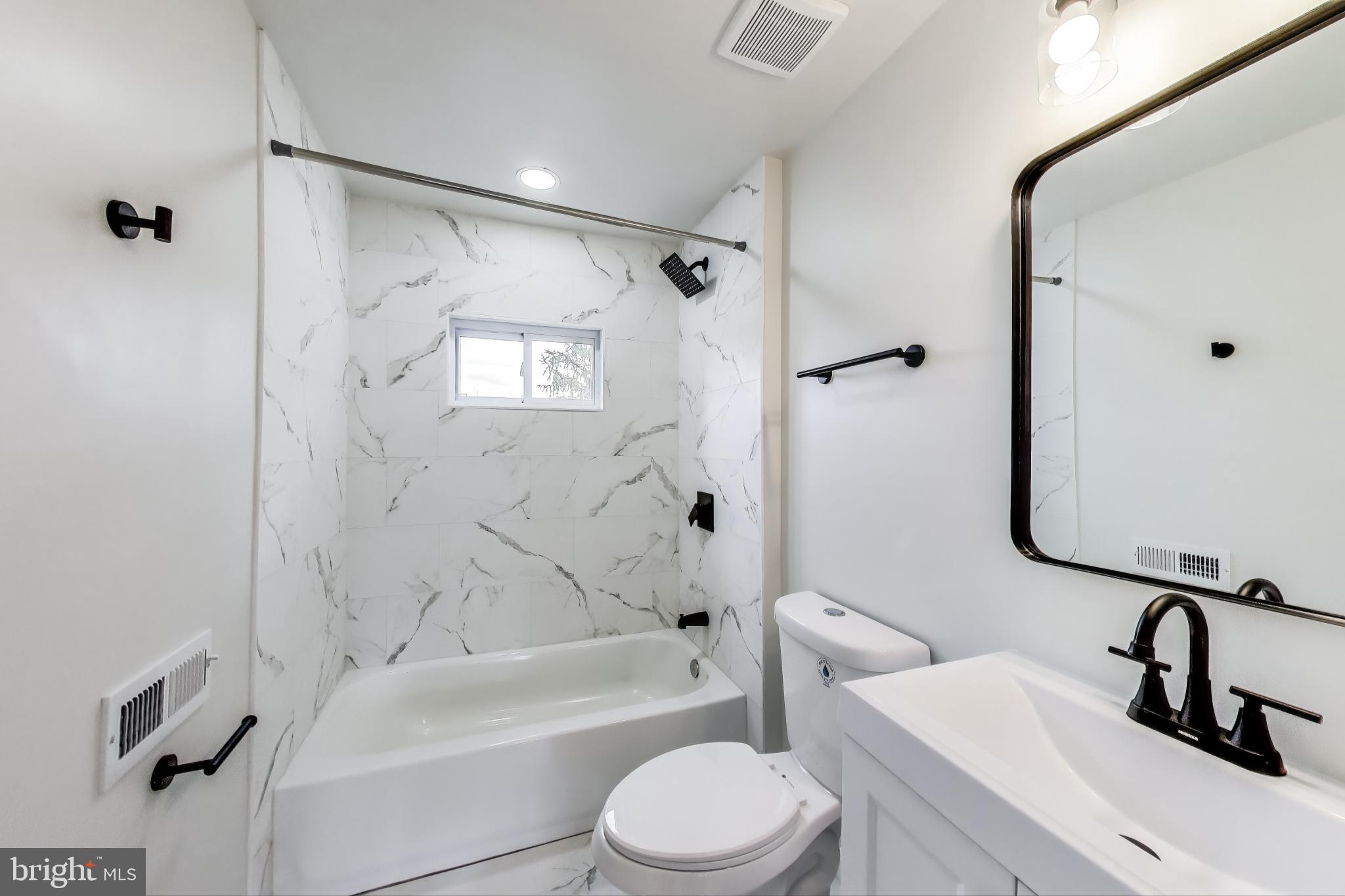 1 Maple Avenue Baltimore, MD 21206 - Photo 43 of 53 a bathroom with a sink toilet and shower