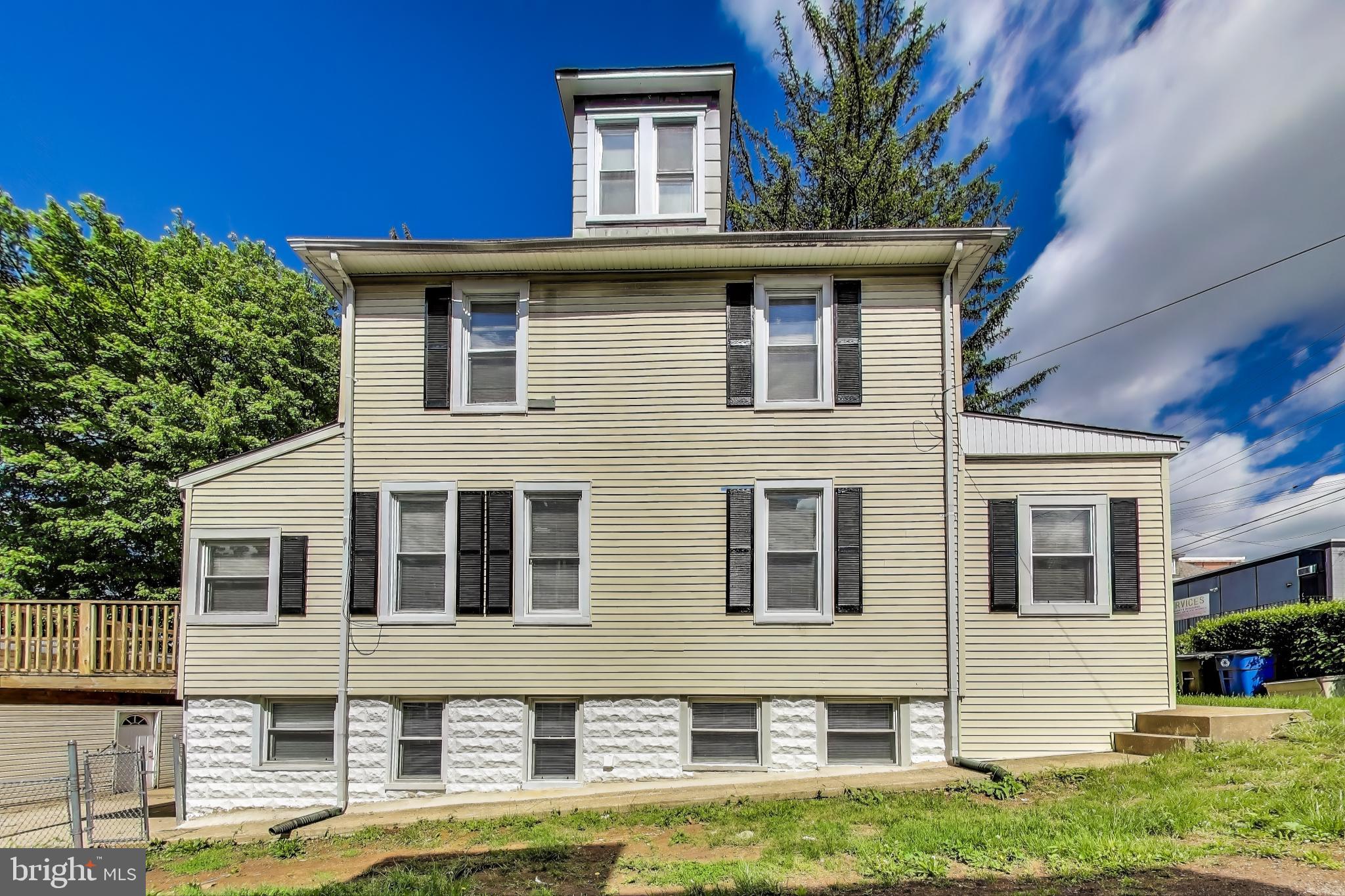 1 Maple Avenue Baltimore, MD 21206 - Photo 44 of 53 a front view of a house with a yard