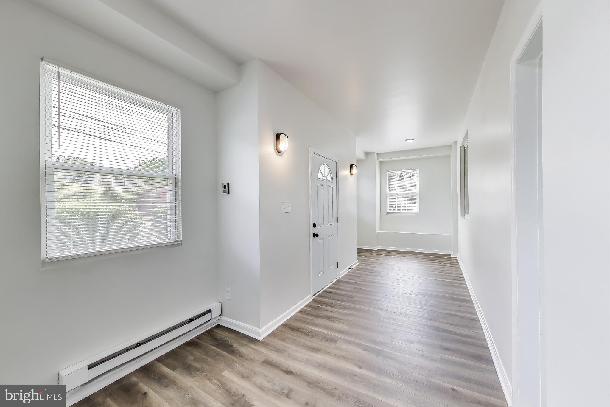 1 Maple Avenue Baltimore, MD 21206 - Photo 5 of 53 a view of an empty room with wooden floor and a window