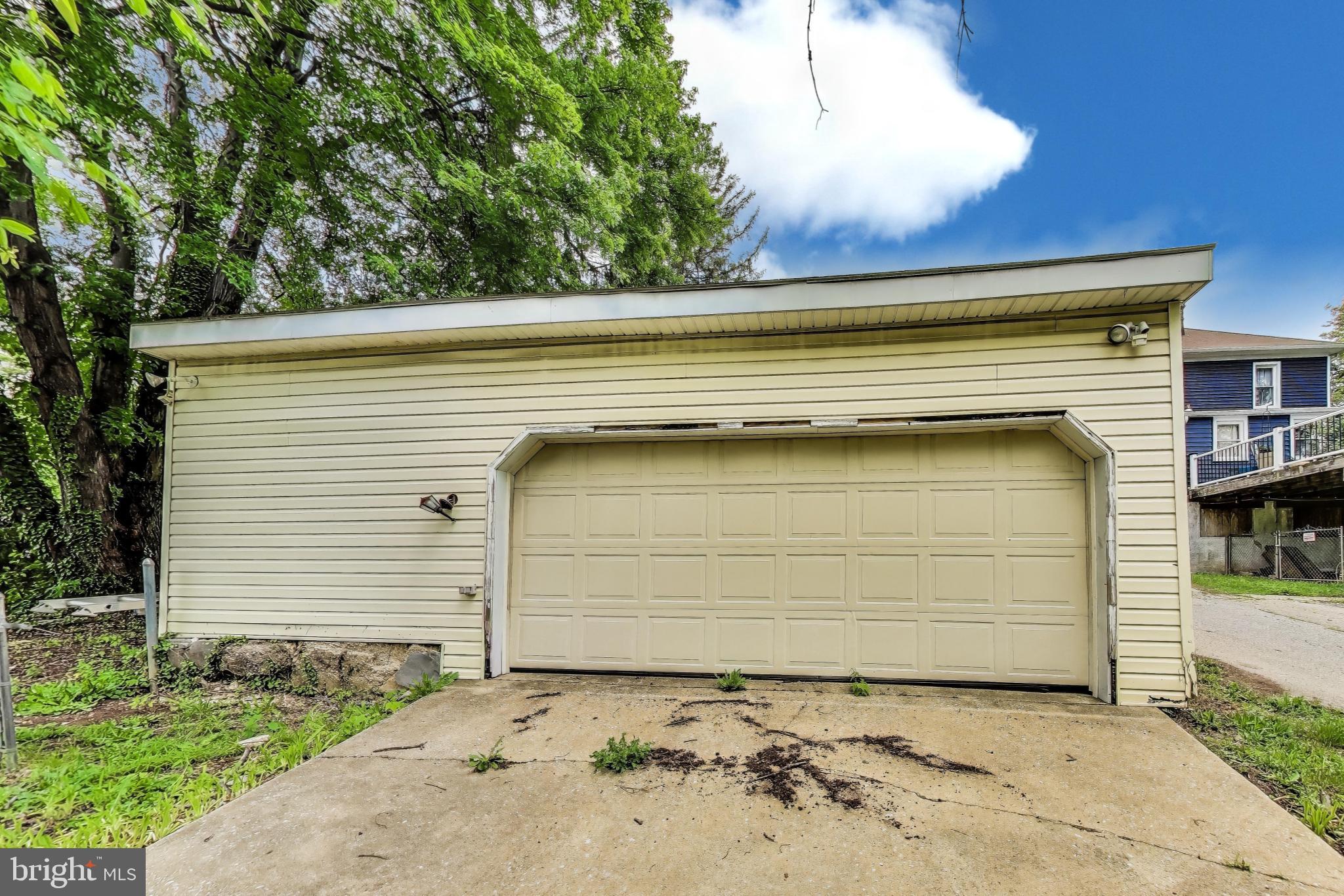 1 Maple Avenue Baltimore, MD 21206 - Photo 52 of 53 a front view of a house with garage