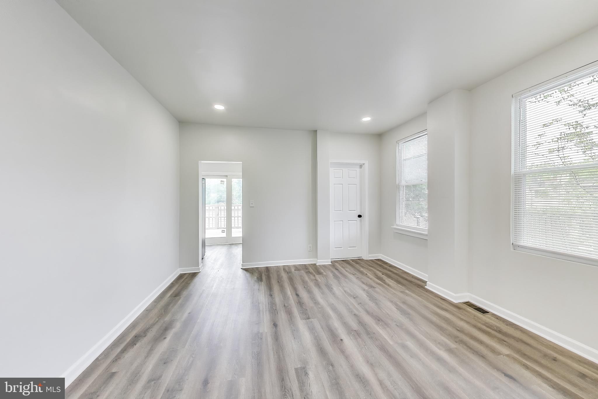 1 Maple Avenue Baltimore, MD 21206 - Photo 7 of 53 a view of empty room with wooden floor and fan