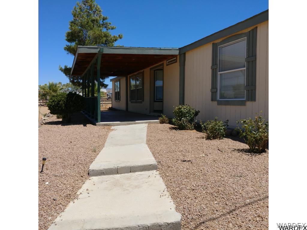 586 Bacobi Road Golden Valley, AZ 86413 - Photo 12 of 36 a view of a house with a yard