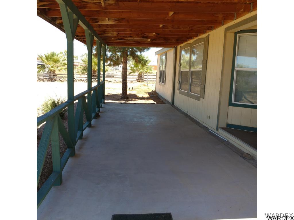 586 Bacobi Road Golden Valley, AZ 86413 - Photo 13 of 36 a view of a porch
