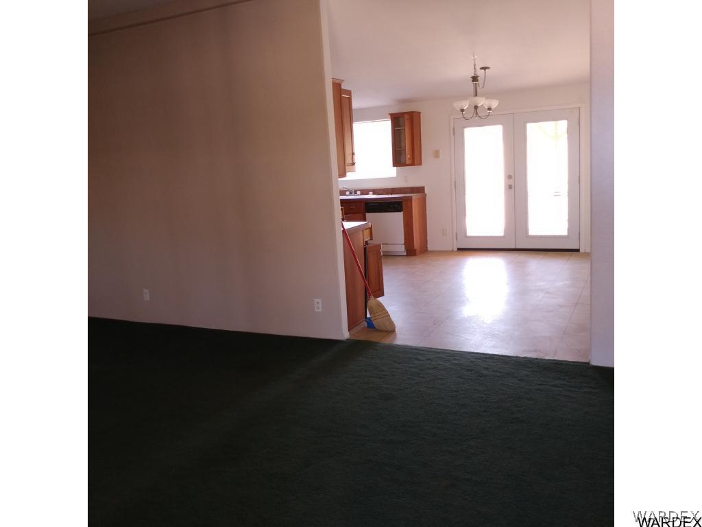 586 Bacobi Road Golden Valley, AZ 86413 - Photo 15 of 36 a view of kitchen and hall with wooden floor