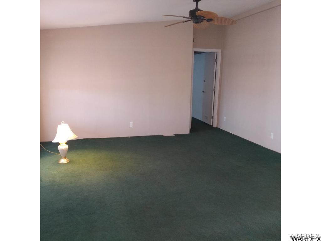 586 Bacobi Road Golden Valley, AZ 86413 - Photo 16 of 36 a view of a room with a ceiling fan and window
