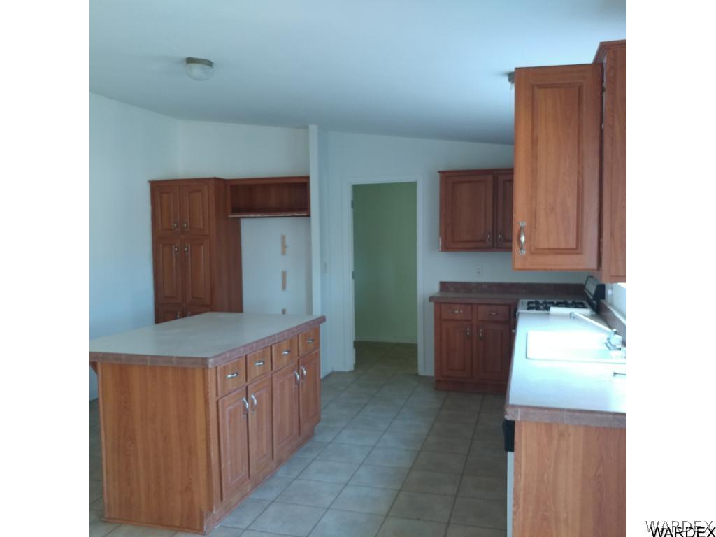 586 Bacobi Road Golden Valley, AZ 86413 - Photo 19 of 36 a room with cabinets and stairs