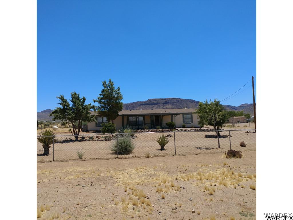 586 Bacobi Road Golden Valley, AZ 86413 - Photo 2 of 36 a view of a backyard