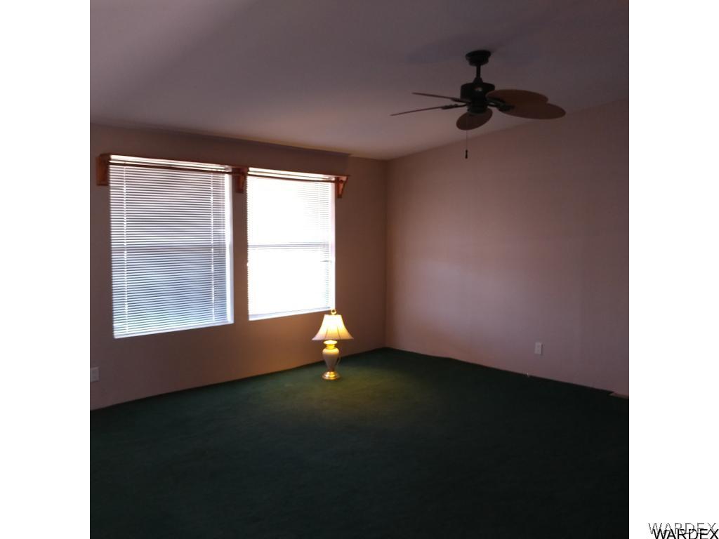 586 Bacobi Road Golden Valley, AZ 86413 - Photo 24 of 36 a view of an empty room with a window