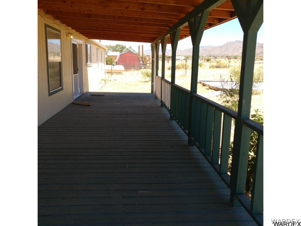 586 Bacobi Road Golden Valley, AZ 86413 - Photo 8 of 36 a view of a porch
