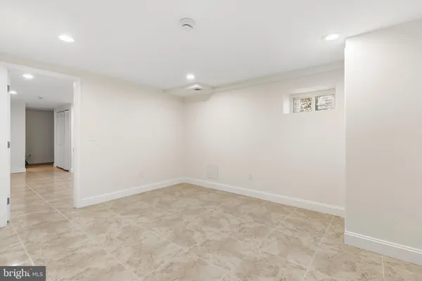 an empty room with a bathroom