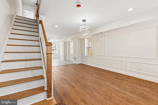 a view of an entryway with wooden floor