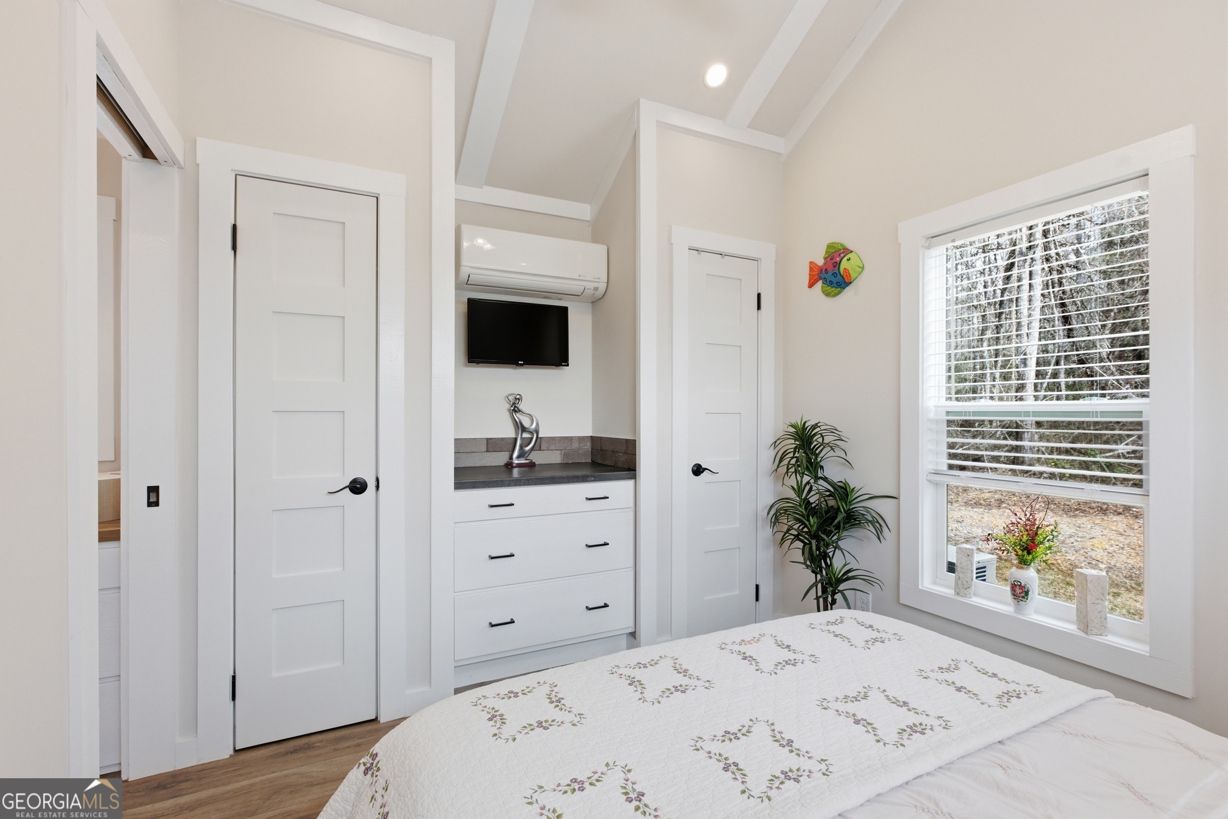 4960 Laurel Lodge Road, Unit 40 Clarkesville, GA 30523 - Photo 18 of 33 a view of a bedroom with wooden floor and windows