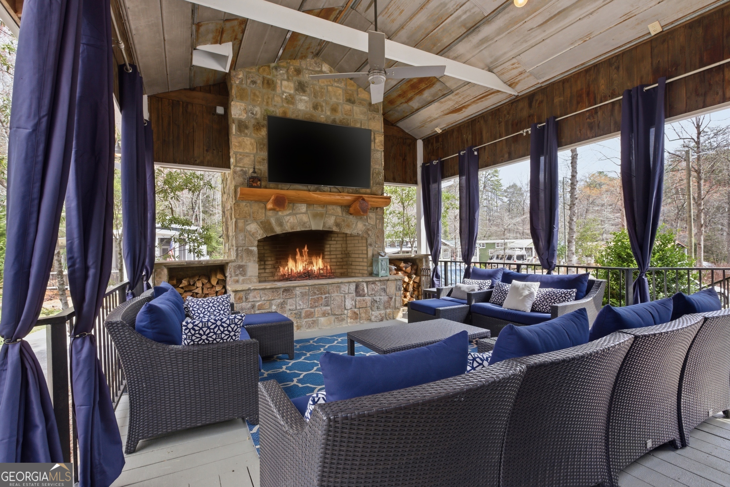 4960 Laurel Lodge Road, Unit 40 Clarkesville, GA 30523 - Photo 21 of 33 a living room with furniture a fireplace and a large window
