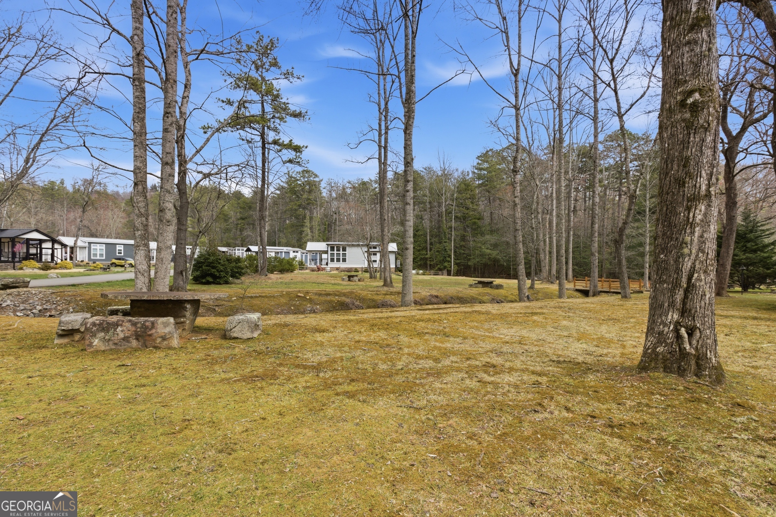4960 Laurel Lodge Road, Unit 40 Clarkesville, GA 30523 - Photo 25 of 33 a backyard of a building with trees