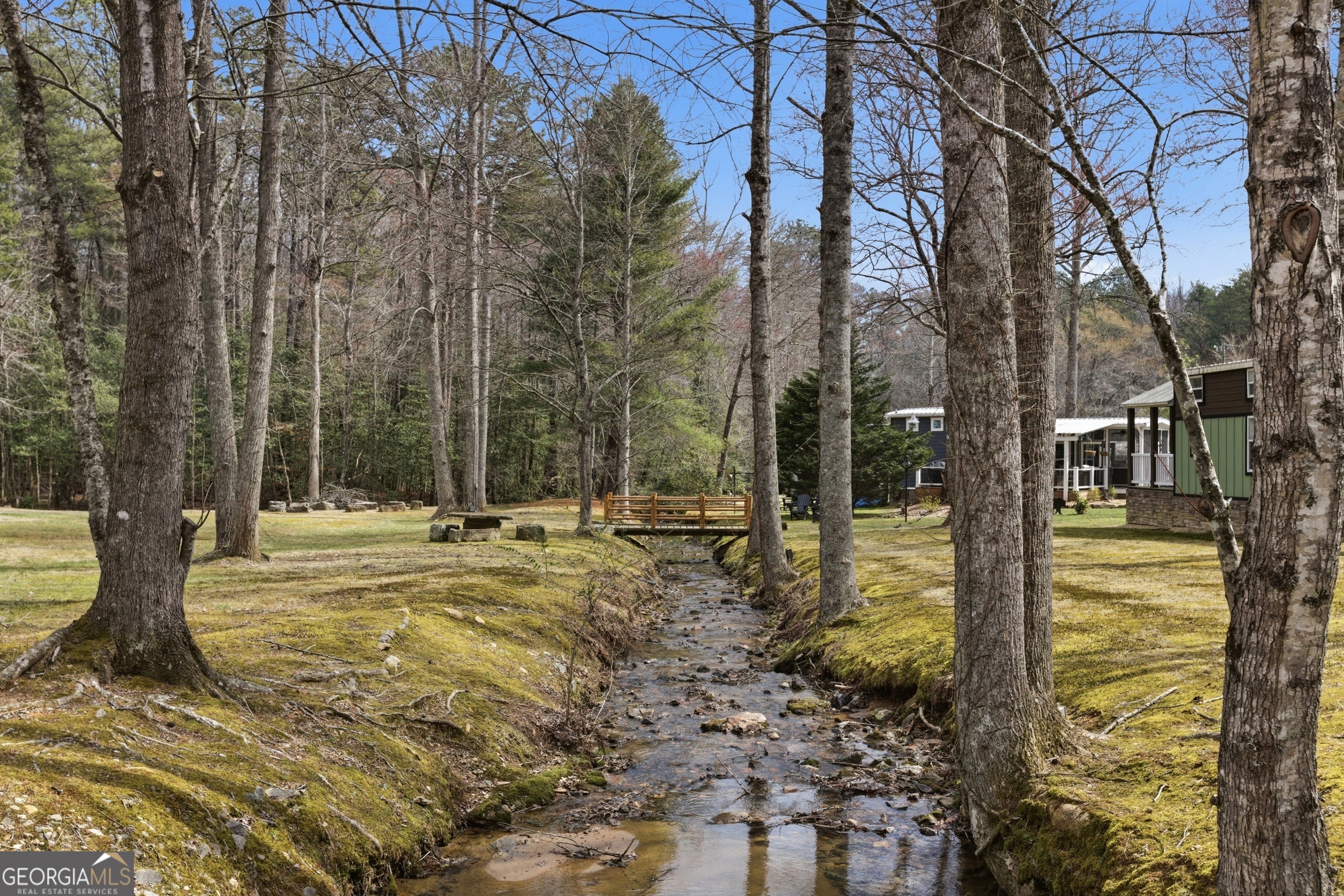 4960 Laurel Lodge Road, Unit 40 Clarkesville, GA 30523 - Photo 30 of 33 a view of a house with backyard and trees