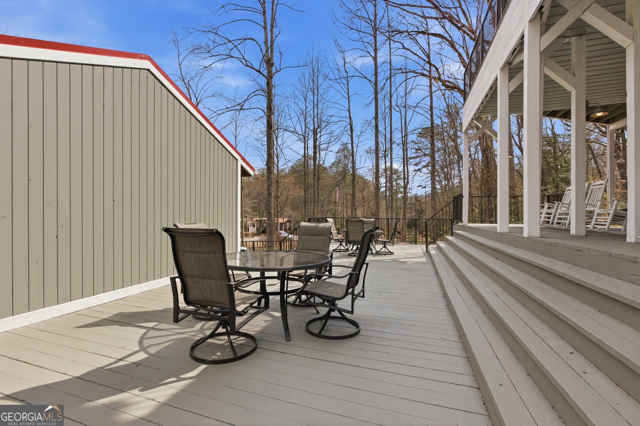 4960 Laurel Lodge Road, Unit 40 Clarkesville, GA 30523 - Photo 33 of 33 a view of a patio with table and chairs and wooden floor