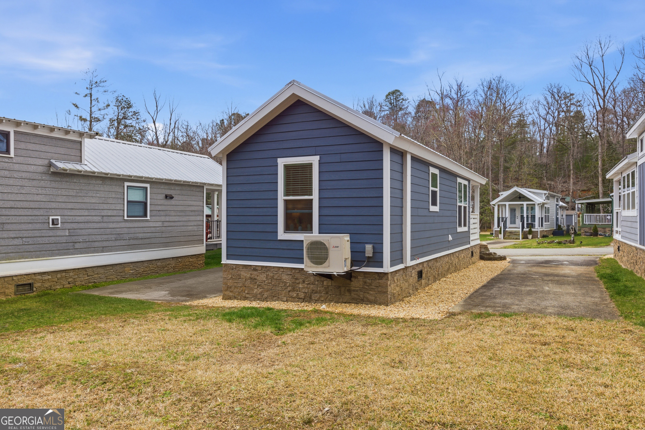 4960 Laurel Lodge Road, Unit 40 Clarkesville, GA 30523 - Photo 5 of 33 a view of a house with a yard and sitting area