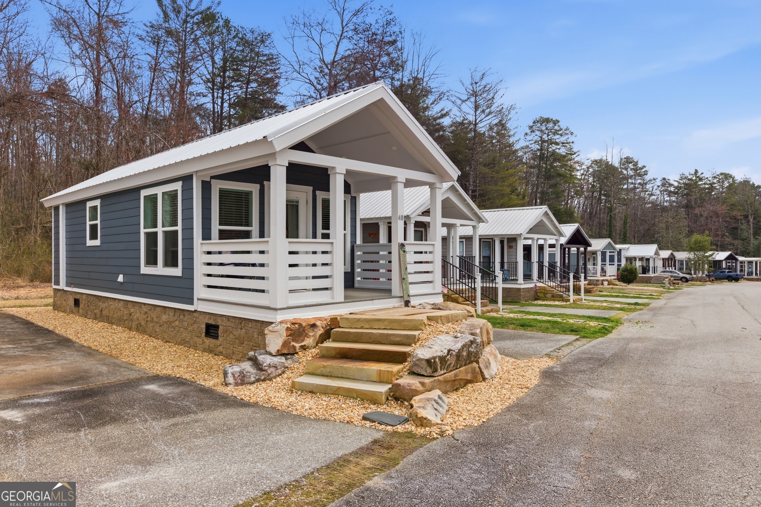 4960 Laurel Lodge Road, Unit 40 Clarkesville, GA 30523 - Photo 6 of 33 a front view of a house with garden