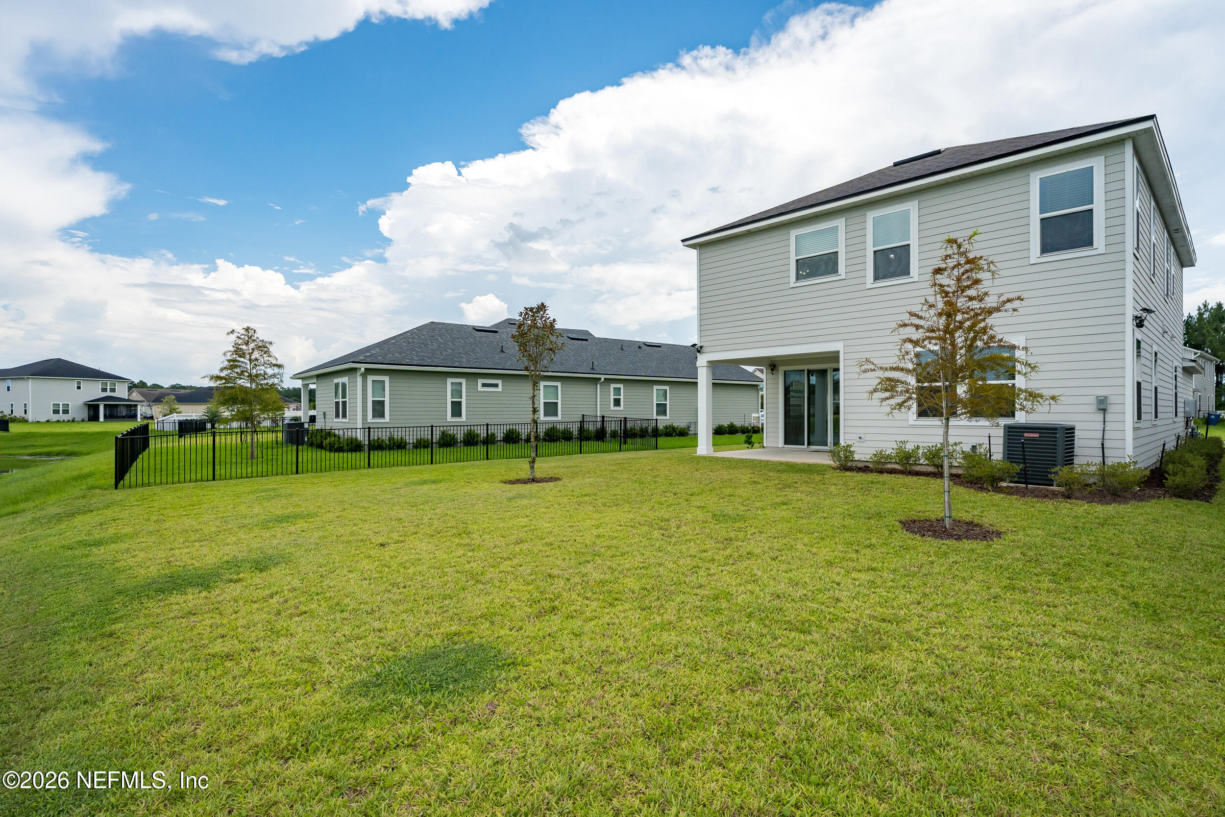 57 Cedar Elm Way St. Augustine, FL 32092 - Photo 40 of 65 a front view of house with a garden