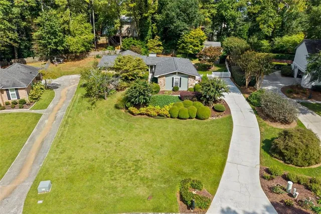 a view of a swimming pool with a garden