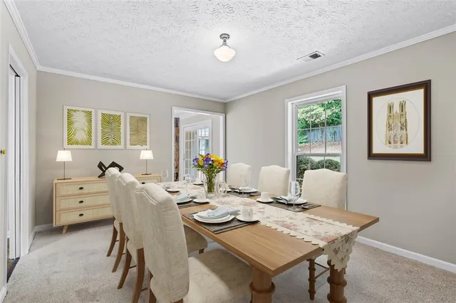 a view of a dining room with furniture