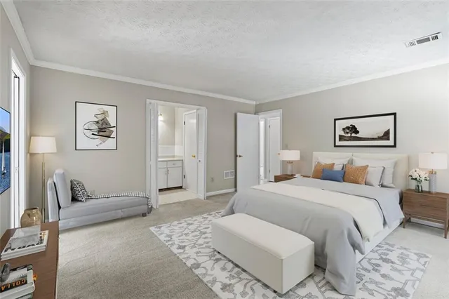 a bedroom with a large bed and a couch