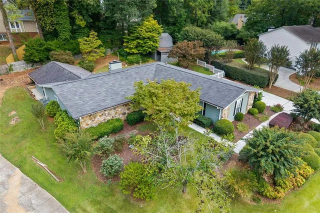 an aerial view of a house with a garden