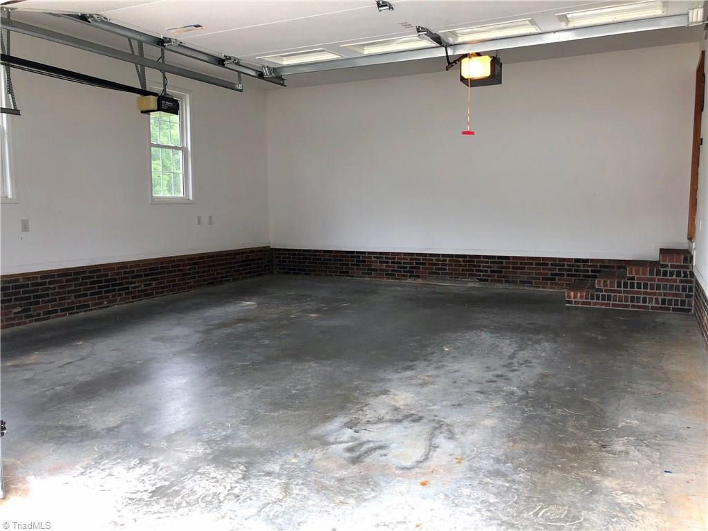 261 Running Creek Road Browns Summit, NC 27214 - Photo 22 of 28 2 Car Attached Oversized Garage - 24' x 23'