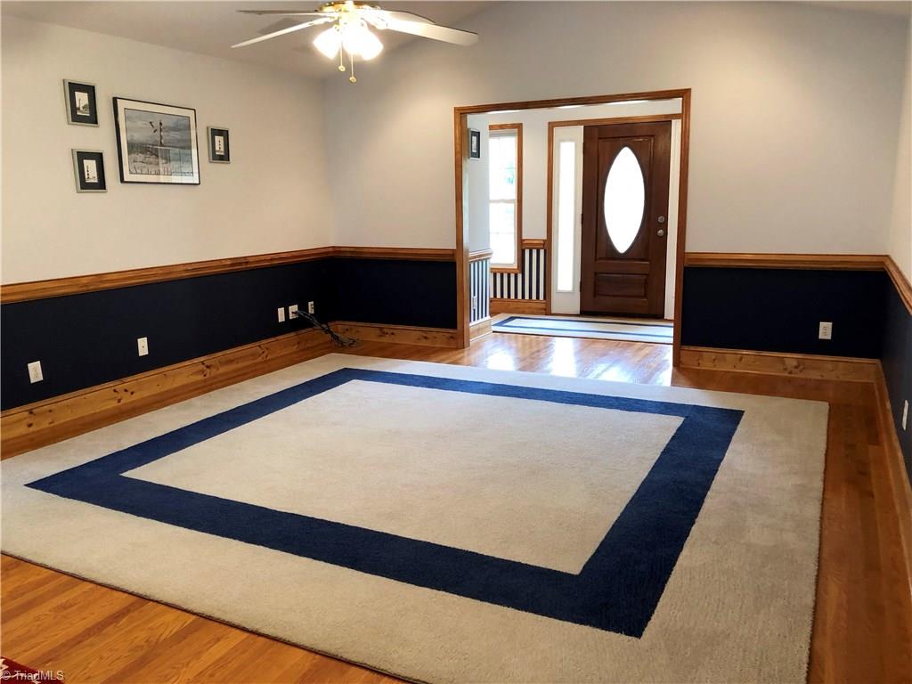 261 Running Creek Road Browns Summit, NC 27214 - Photo 4 of 28 A Great Room your family will love and enjoy!!! Wired surround sound speakers, hardwoods, wood trim and recessed lighting. All the custom rugs throughout the house stay.
