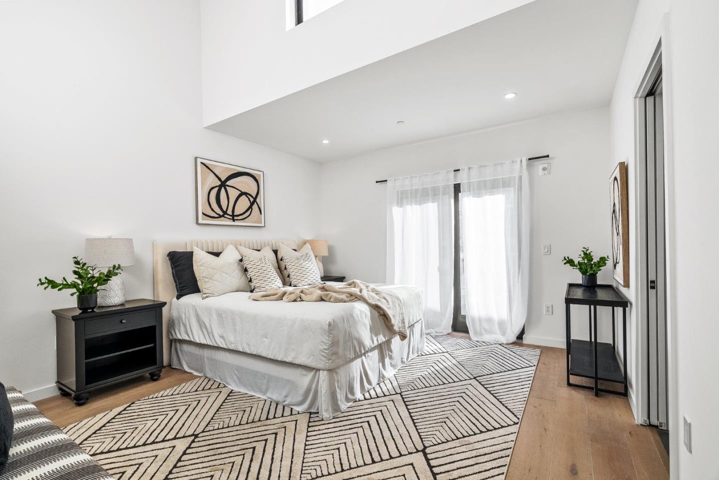 908 Woodside Road Redwood City, CA 94061 - Photo 15 of 26 a bedroom with a bed and a couch