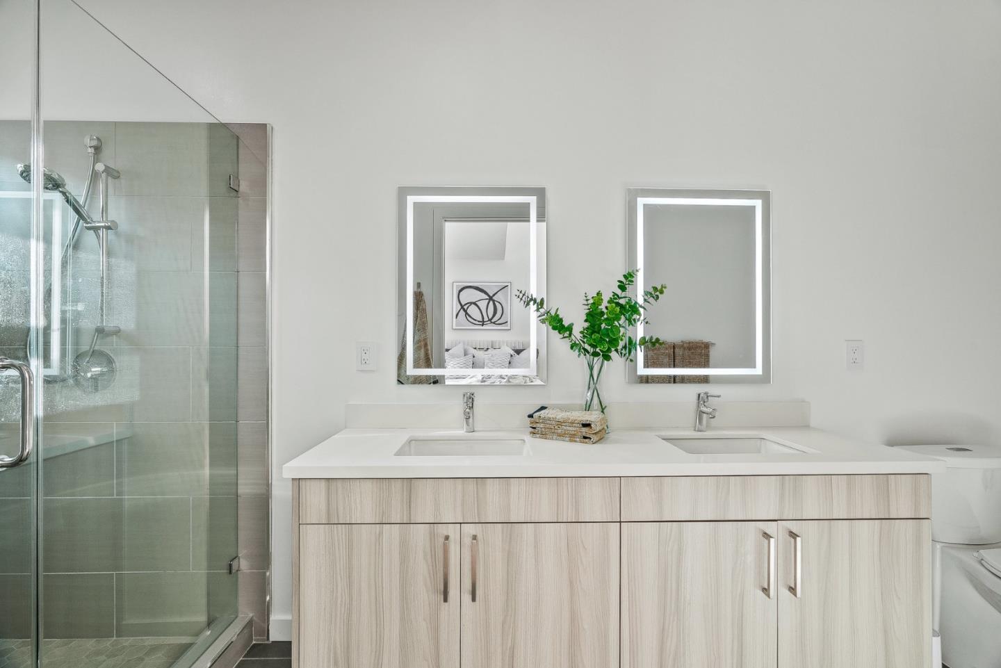 908 Woodside Road Redwood City, CA 94061 - Photo 18 of 26 a bathroom with a sink a mirror and a shower