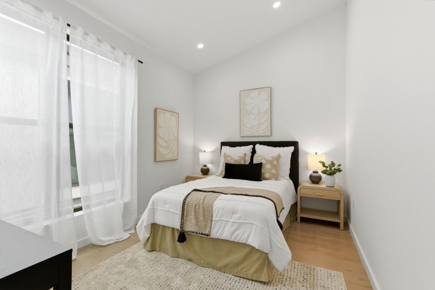 908 Woodside Road Redwood City, CA 94061 - Photo 20 of 26 a bedroom with a bed and a chandelier