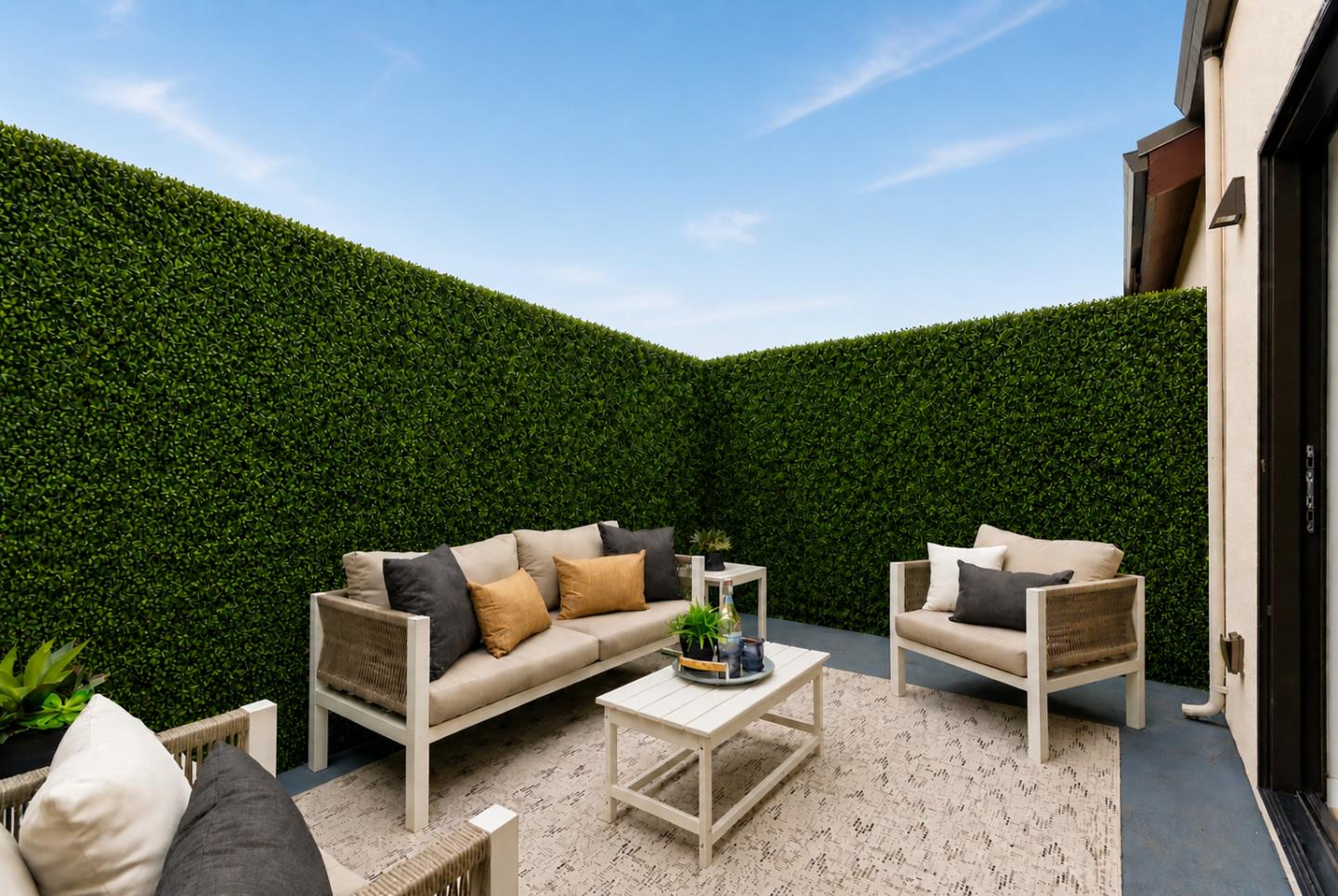 908 Woodside Road Redwood City, CA 94061 - Photo 24 of 26 a view of patio with couches and a table and chairs with wooden floor and fence