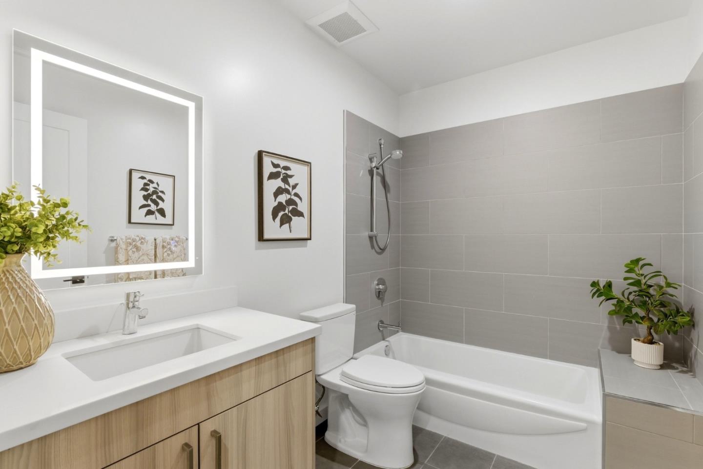 908 Woodside Road Redwood City, CA 94061 - Photo 6 of 26 a bathroom with a sink a toilet and shower