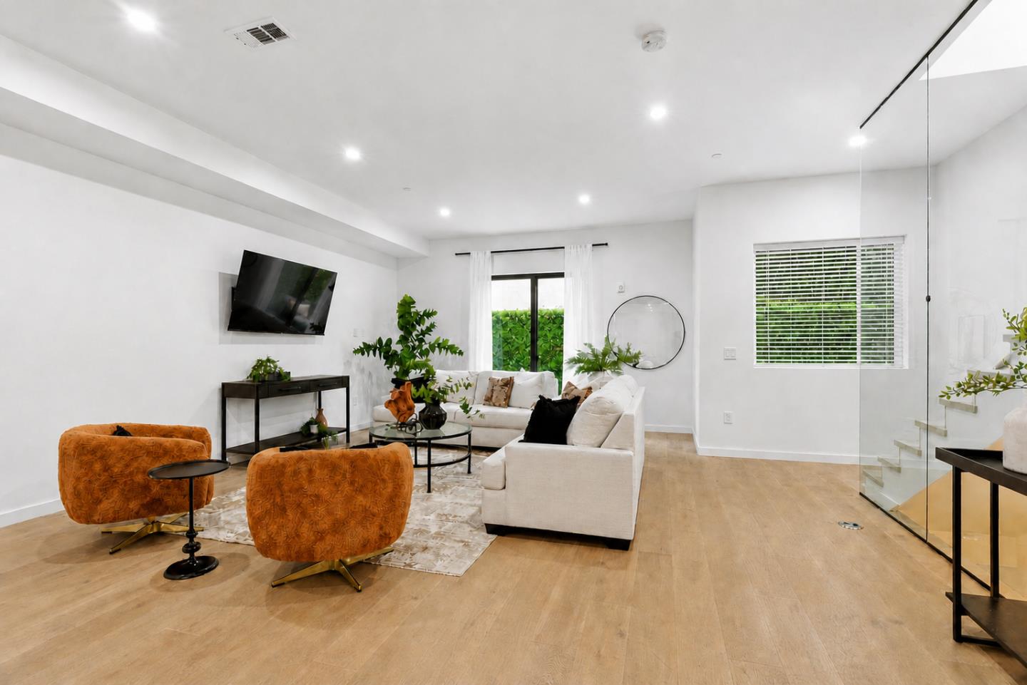 908 Woodside Road Redwood City, CA 94061 - Photo 8 of 26 a living room with furniture a window and a flat screen tv