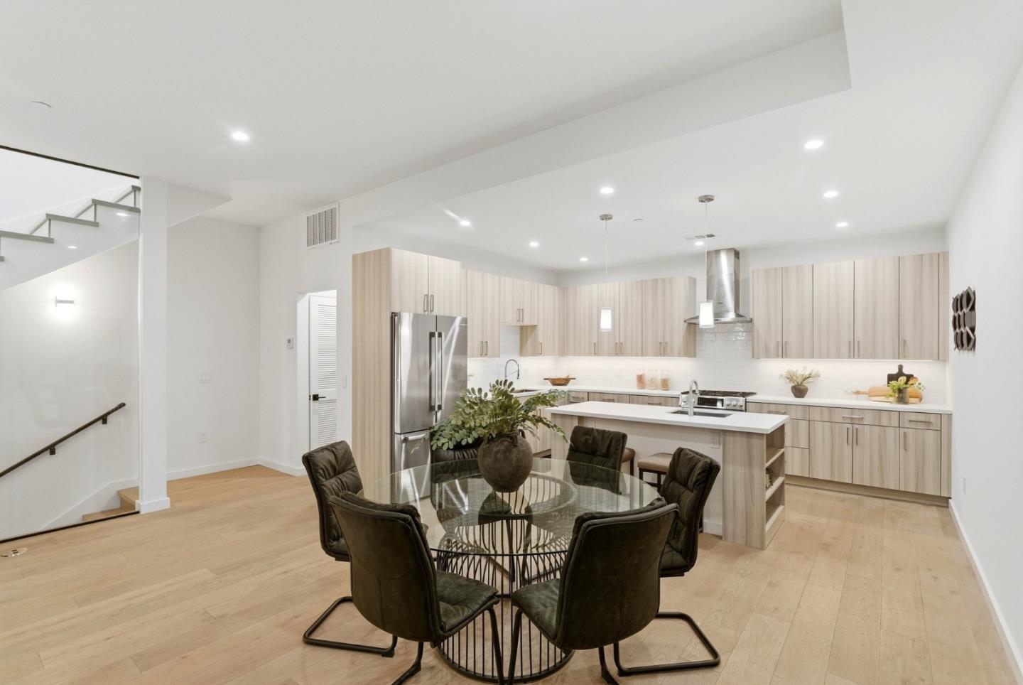 908 Woodside Road Redwood City, CA 94061 - Photo 10 of 26 a large kitchen with a table and chairs in it