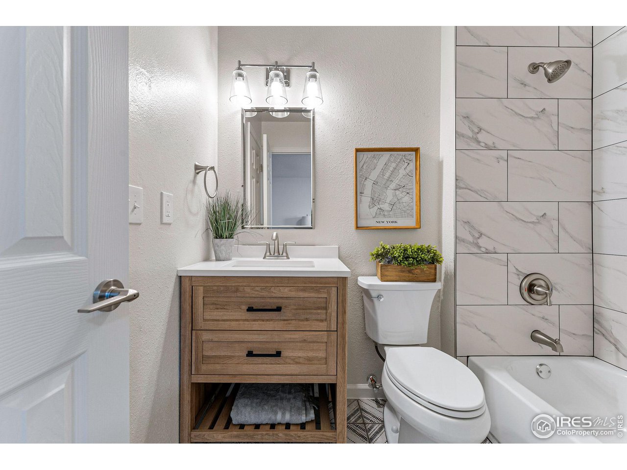 216 Summit Circle Lafayette, CO 80026 - Photo 21 of 35 a bathroom with a toilet a sink and mirror