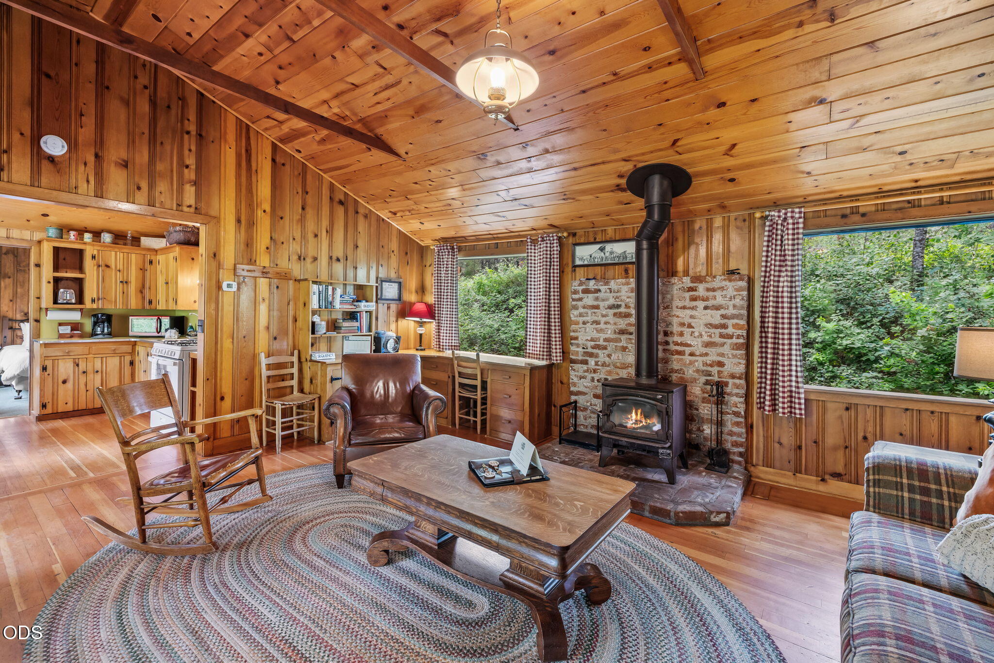 13375 Southwest Forest Service Road, Unit 3 U1 Camp Sherman, OR 97730 - Photo 7 of 29 a living room with patio furniture and a large window