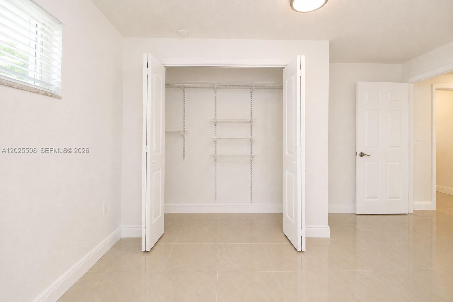 9421 Southwest 150th Street Miami, FL 33176 - Photo 14 of 31 a view of room with window