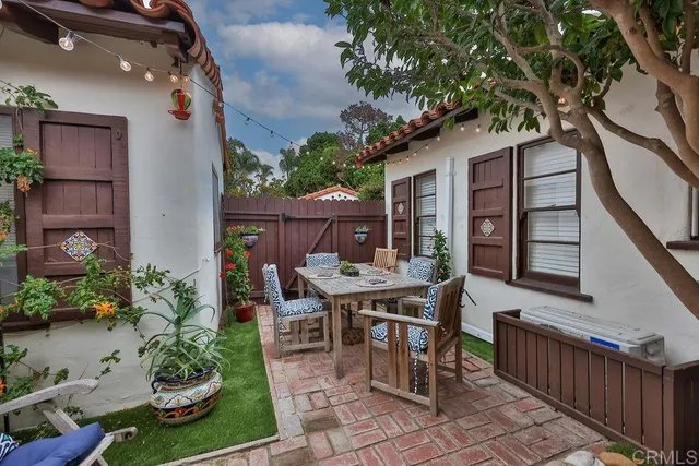 a outdoor living space with furniture and a potted plant