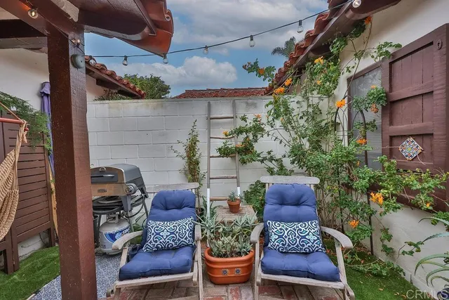 a front view of a building with chairs