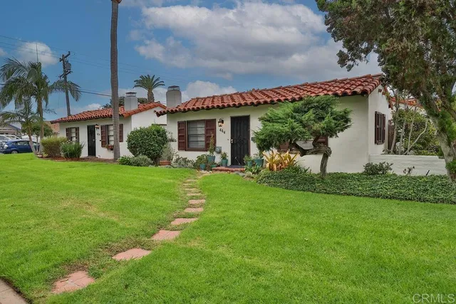 a front view of house with yard and green space