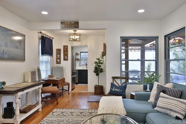 a living room with furniture or outdoor view and a large window