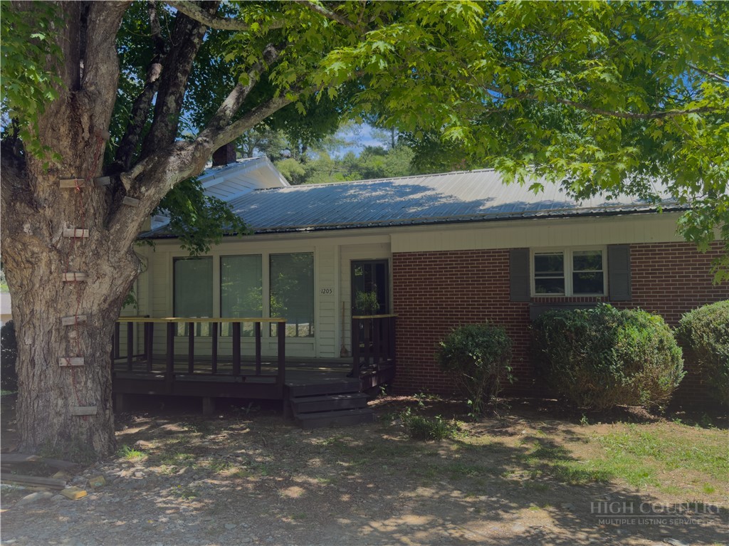 1205 Bamboo Road Boone, NC 28607 - Photo 2 of 17 a view of a house with a yard