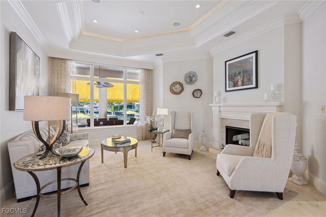 361 Pirates Bight Naples, FL 34103 - Photo 13 of 33 a living room with furniture and a fireplace