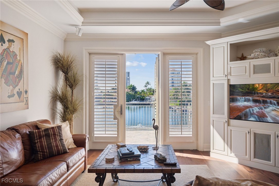 361 Pirates Bight Naples, FL 34103 - Photo 17 of 33 a living room with furniture and a large window