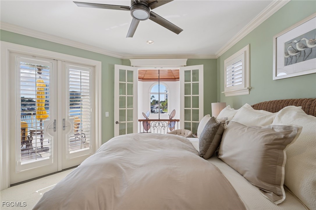 361 Pirates Bight Naples, FL 34103 - Photo 18 of 33 a bed sitting in a bedroom next to a window