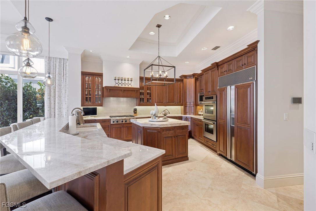 361 Pirates Bight Naples, FL 34103 - Photo 2 of 33 a kitchen with granite countertop a sink a counter top space a stove and refrigerator