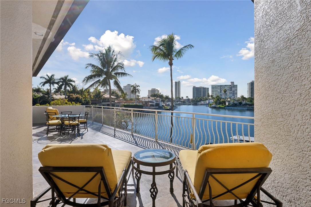 361 Pirates Bight Naples, FL 34103 - Photo 21 of 33 a view of a chairs and table in patio