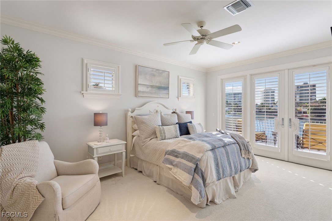 361 Pirates Bight Naples, FL 34103 - Photo 22 of 33 a spacious bedroom with a bed and a couch